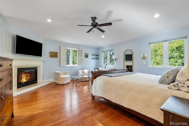 2400 S Clayton St, Denver, CO 80210 - bedroom featuring a glass covered fireplace, wood finished floors, recessed lighting, and ceiling fan