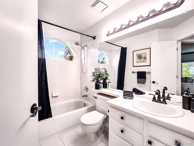 full bathroom featuring visible vents, tile patterned flooring, shower / tub combo, vanity, and toilet