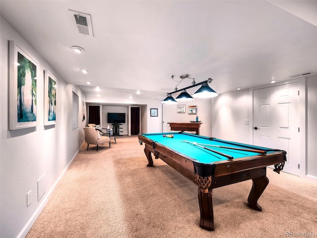 rec room featuring baseboards, light colored carpet, and visible vents