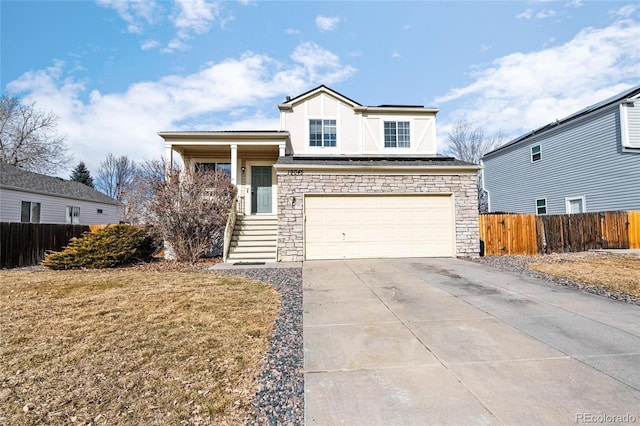 view of front of property featuring a garage and a front lawn