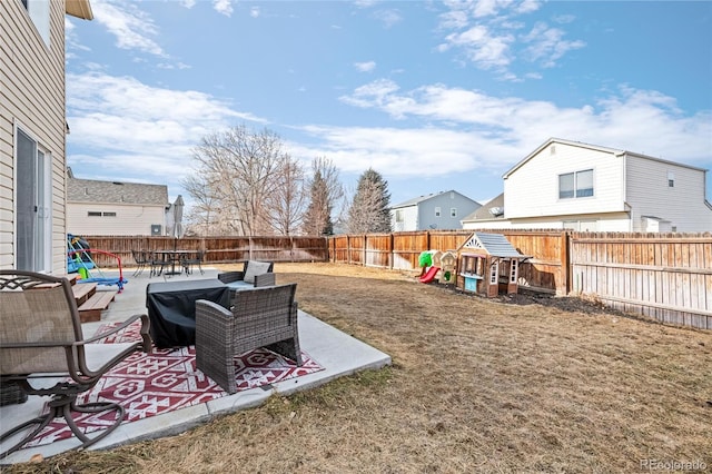 view of yard with a playground and a patio area