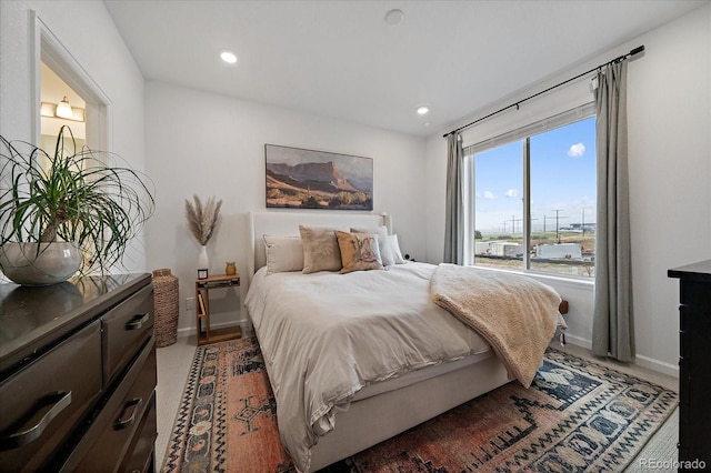 bedroom featuring baseboards, carpet floors, and recessed lighting