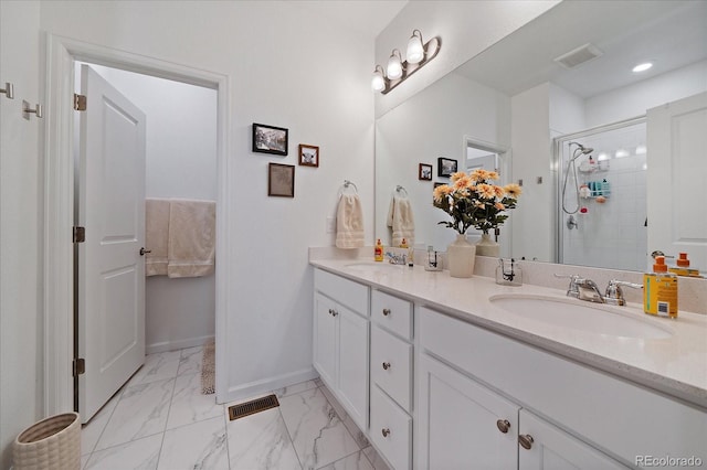 bathroom featuring a stall shower, baseboards, marble look tiles, and double vanity