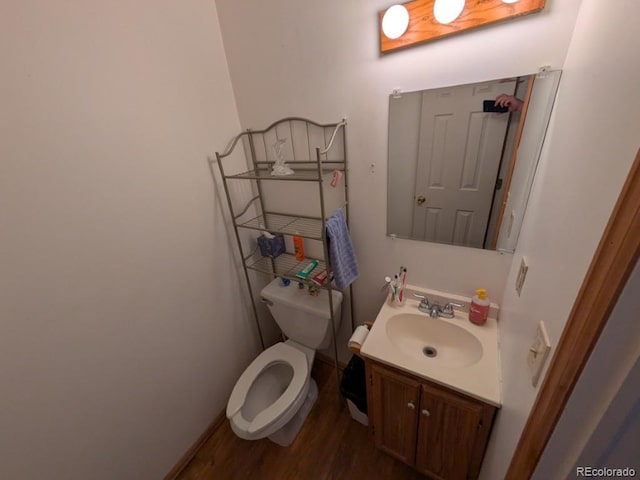 290 W 1st Ave, Broomfield, CO 80020 - half bath featuring vanity and wood finished floors