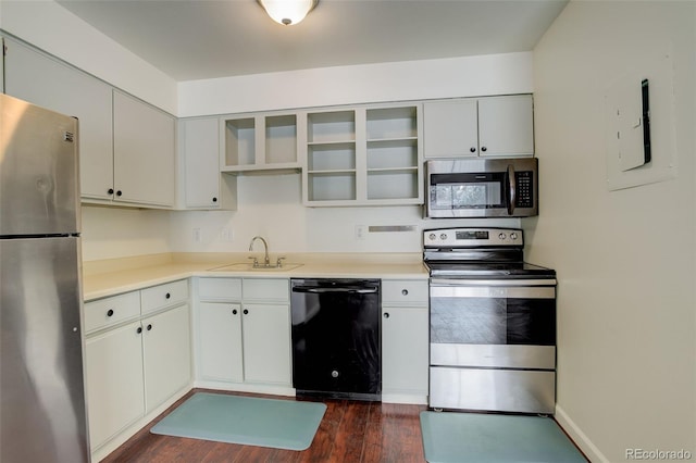 kitchen with white cabinetry, sink, dark wood-type flooring, and appliances with stainless steel finishes