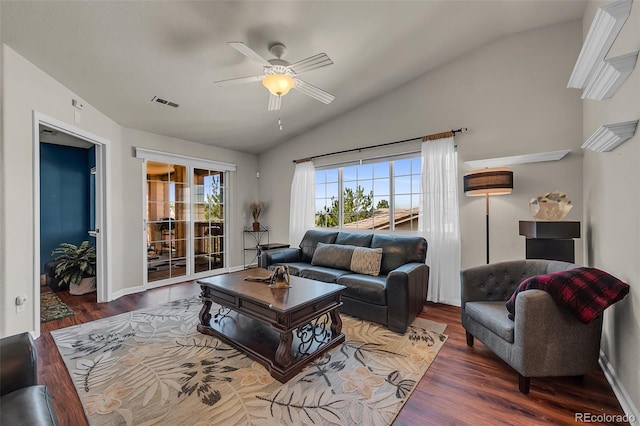 living room featuring vaulted ceiling, ceiling fan, and dark hardwood / wood-style flooring