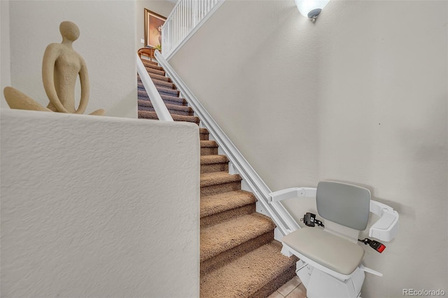 stairway featuring tile patterned floors