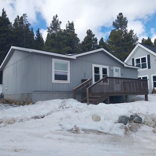 view of front of home featuring a wooden deck