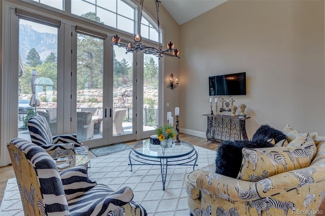 living room featuring vaulted ceiling and light wood-type flooring