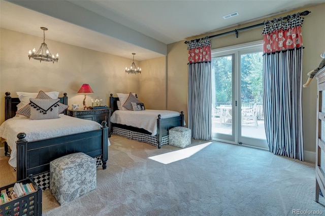 bedroom featuring light carpet, an inviting chandelier, and access to outside