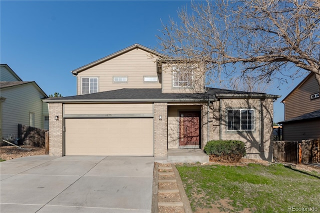 2875 S Tower Way, Aurora, CO 80013 - traditional home featuring brick siding, driveway, and an attached garage