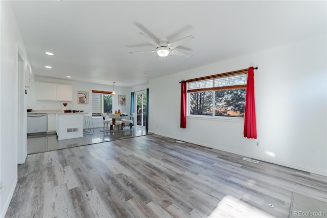 2875 S Tower Way, Aurora, CO 80013 - unfurnished living room featuring a ceiling fan, light wood-type flooring, and recessed lighting