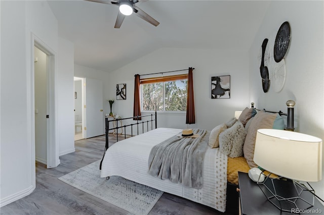 2875 S Tower Way, Aurora, CO 80013 - bedroom with vaulted ceiling, wood finished floors, and a ceiling fan
