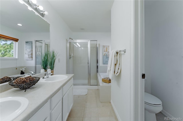 2875 S Tower Way, Aurora, CO 80013 - full bath featuring a shower stall, double vanity, and tile patterned flooring