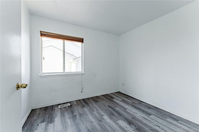 2875 S Tower Way, Aurora, CO 80013 - spare room with wood finished floors and baseboards