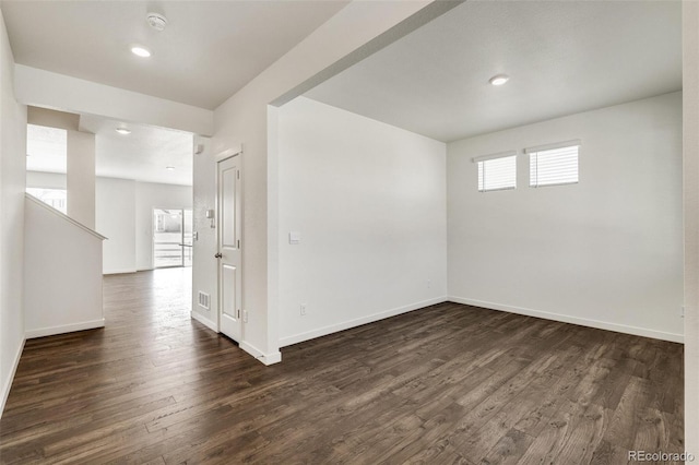 unfurnished room with dark hardwood / wood-style floors