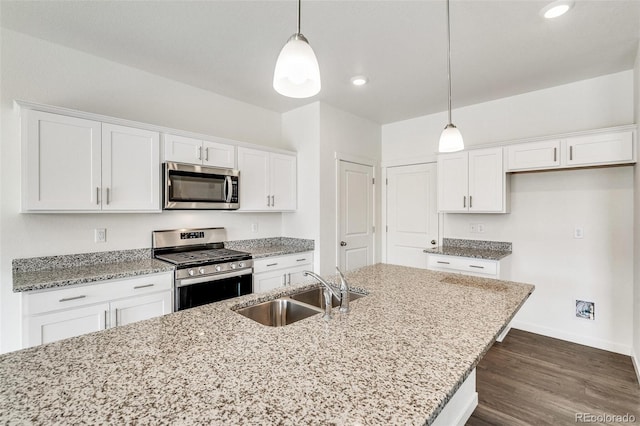 kitchen with white cabinetry, sink, and stainless steel appliances