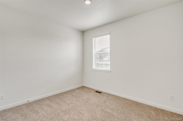 empty room with carpet flooring