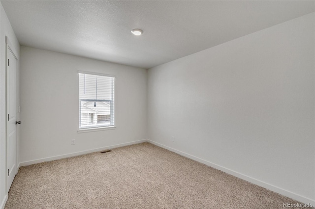 empty room with carpet flooring