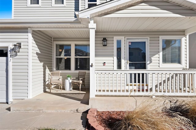 doorway to property featuring a porch