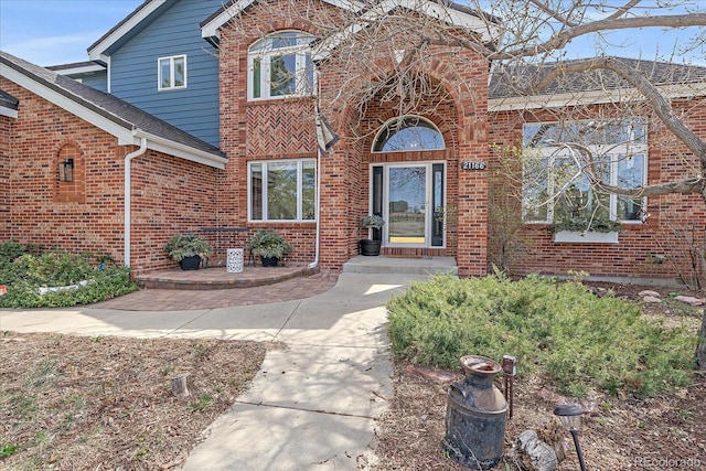 entrance to property with brick siding