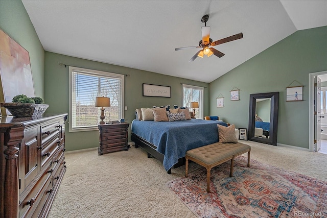 bedroom with light colored carpet, vaulted ceiling, a ceiling fan, and baseboards