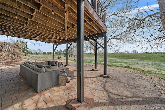 view of patio / terrace with a rural view and an outdoor hangout area