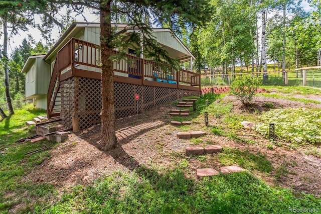 7256 Aspen Meadow Dr, Evergreen, CO 80439 - view of yard featuring stairway and a deck
