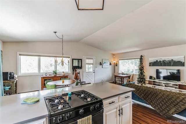 7256 Aspen Meadow Dr, Evergreen, CO 80439 - kitchen featuring black gas stove, vaulted ceiling, white cabinets, pendant lighting, and dark wood-style floors