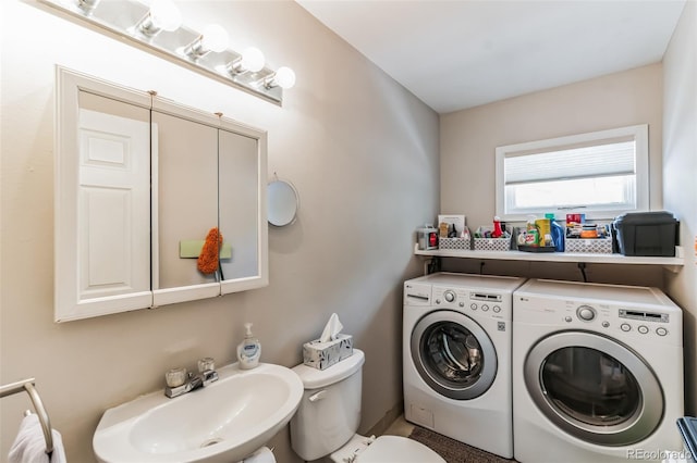 7256 Aspen Meadow Dr, Evergreen, CO 80439 - bathroom featuring washing machine and clothes dryer and a sink