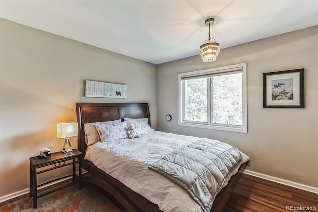 7256 Aspen Meadow Dr, Evergreen, CO 80439 - bedroom featuring baseboards and wood finished floors