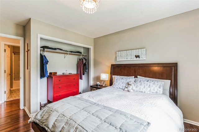 7256 Aspen Meadow Dr, Evergreen, CO 80439 - bedroom featuring wood finished floors and a closet