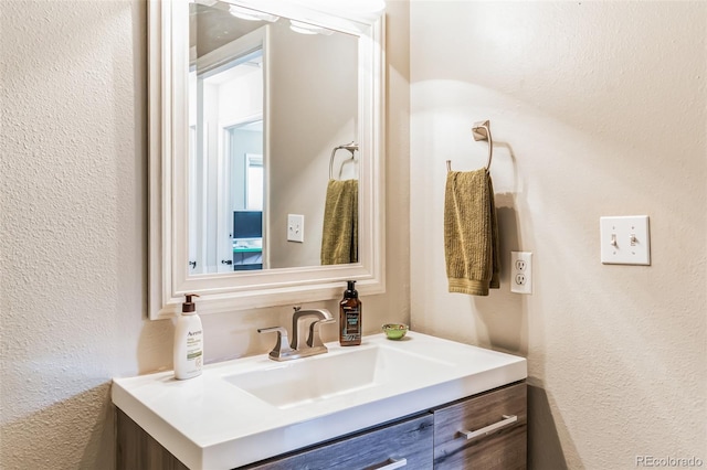 7256 Aspen Meadow Dr, Evergreen, CO 80439 - bathroom featuring a textured wall and vanity