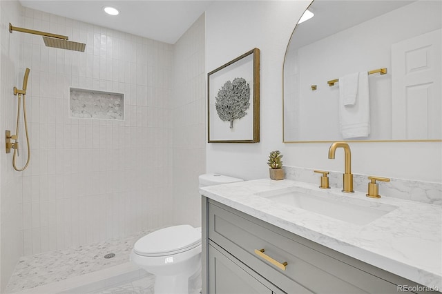 full bath with vanity, recessed lighting, a tile shower, toilet, and marble finish floor