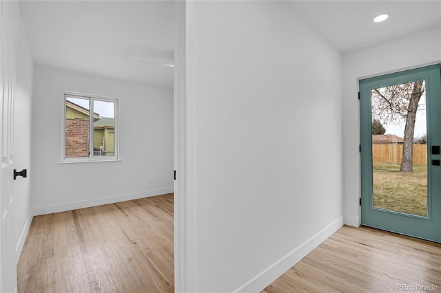 entryway featuring recessed lighting, baseboards, and wood finished floors