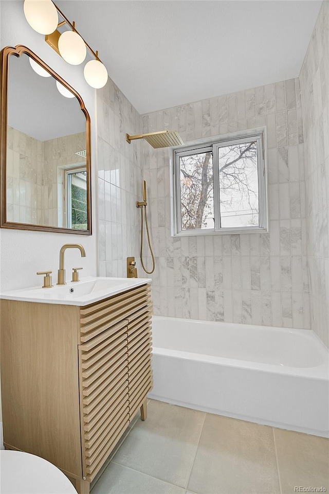 bathroom featuring tile patterned flooring, toilet, vanity, and shower / bath combination