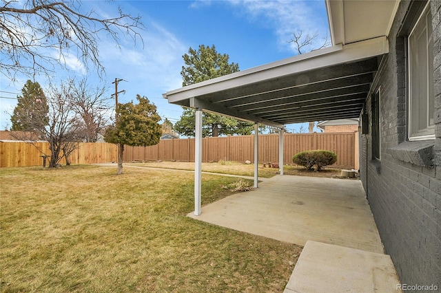 view of yard with a patio area and a fenced backyard