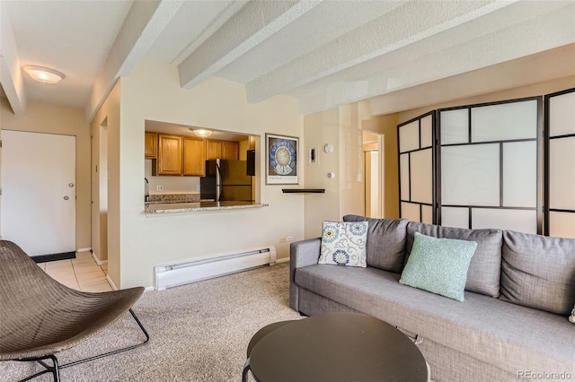 carpeted living room featuring a textured ceiling, baseboard heating, and beamed ceiling