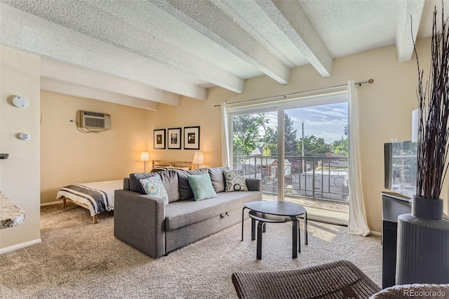 living room featuring light colored carpet, a textured ceiling, beamed ceiling, and an AC wall unit