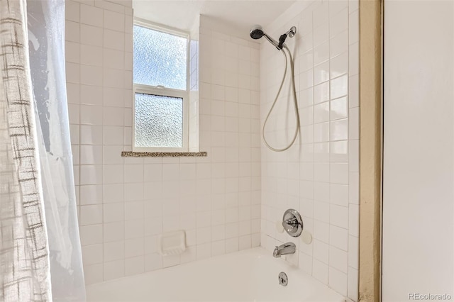 bathroom featuring shower / tub combo with curtain