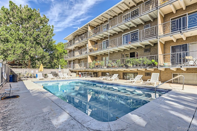 view of swimming pool with a patio