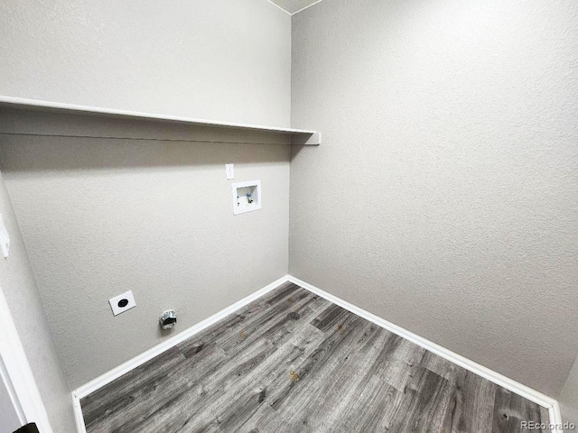 laundry area featuring washer hookup, hookup for an electric dryer, and wood-type flooring