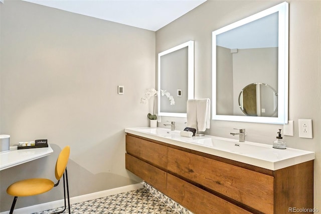 6681 S Abilene Way, Centennial, CO 80111 - full bathroom featuring tile patterned floors, double vanity, baseboards, and a sink