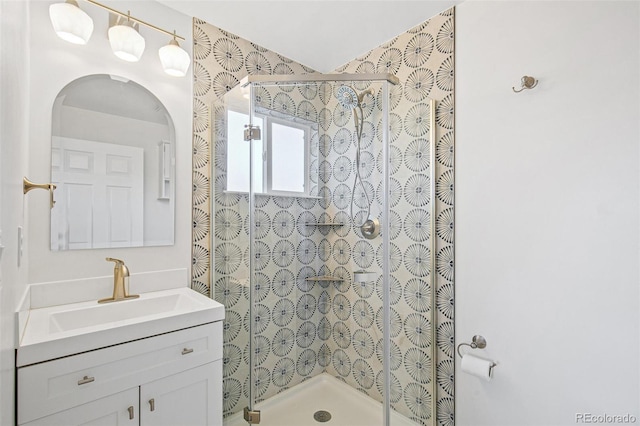 bathroom with vanity and a stall shower