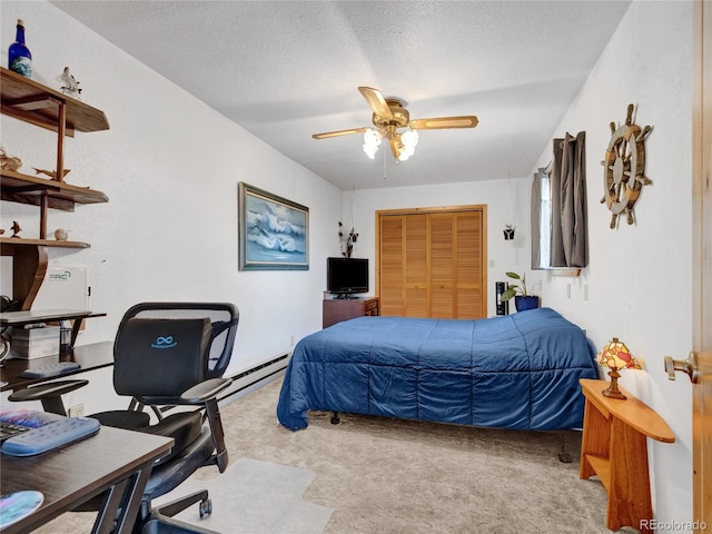 carpeted bedroom with a textured ceiling, a closet, and ceiling fan