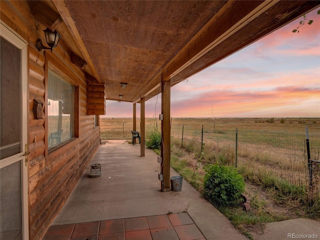 patio terrace at dusk with a rural view