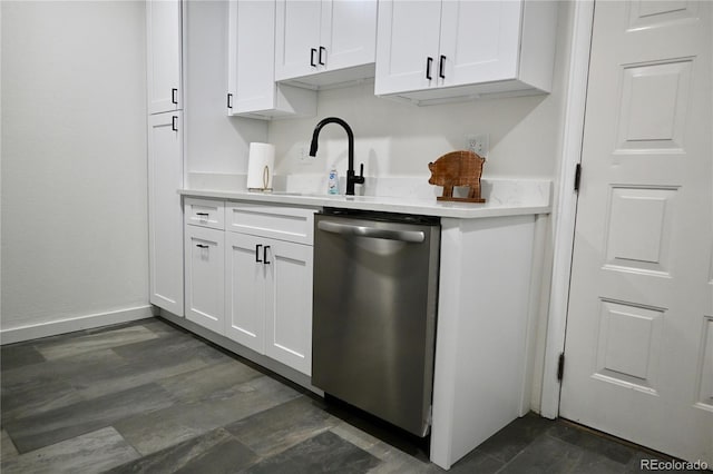 bar featuring dark hardwood / wood-style flooring, sink, dishwasher, and white cabinetry