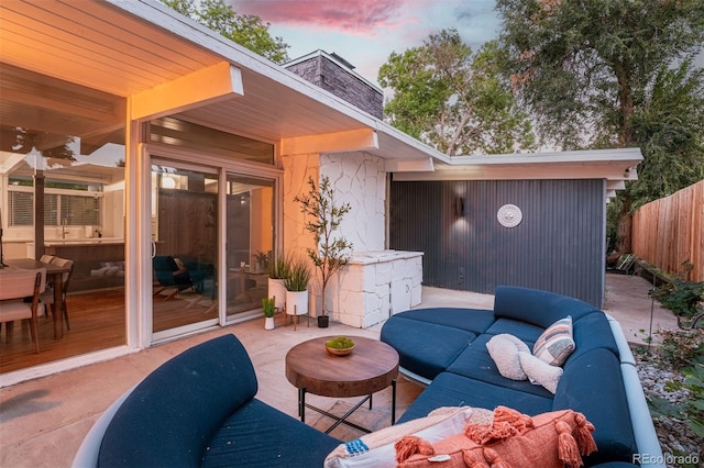 view of patio terrace at dusk