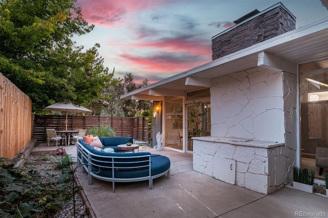 patio terrace at dusk with an outdoor hangout area