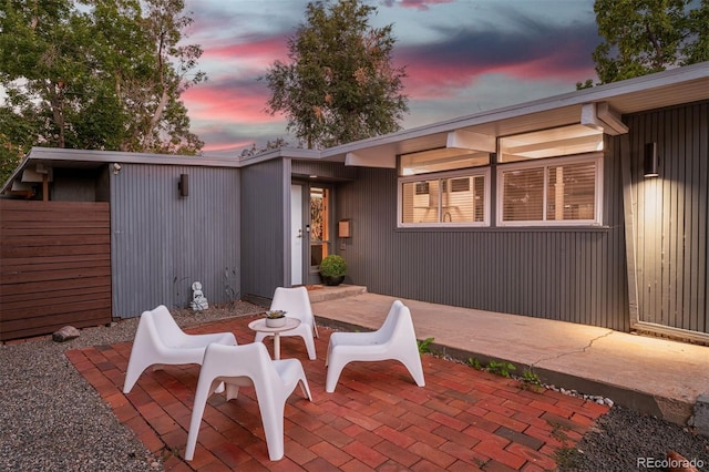 view of patio terrace at dusk